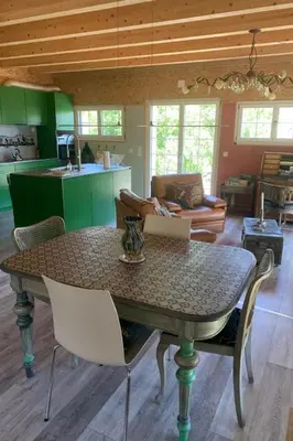 a table and chairs in a living room at Apartment nirkwerk by Interhome in Schönengrund