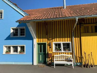 a colorful house with a bench in front of it at Apartment nirkwerk by Interhome in Schönengrund