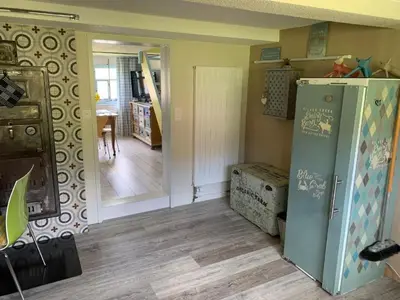 a kitchen with a refrigerator and a dining room at Apartment nirkwerk by Interhome in Schönengrund