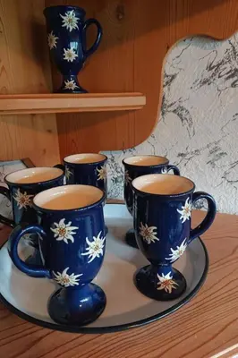 a group of blue vases on a tray on a table at Apartment Alpen-Paradies Edelweiss Urnäsch by Interhome in Urnäsch