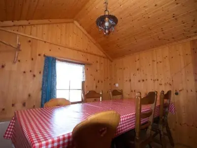 a dining room with a table and chairs and a window at Apartment Hasenbüel by Interhome in Ricken