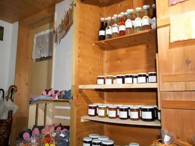 a kitchen with shelves filled with lots of jars at Apartment Hasenbüel by Interhome in Ricken