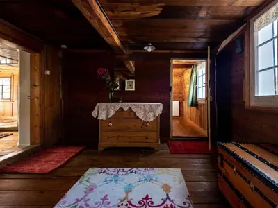 a room with a dresser in a wooden house at Holiday Home Lindeli by Interhome in Sankt Peterzell