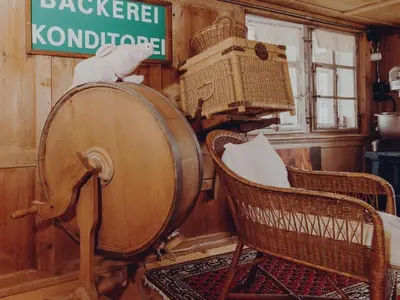 a wooden barrel and two chairs in a room at Holiday Home Lindeli by Interhome in Sankt Peterzell