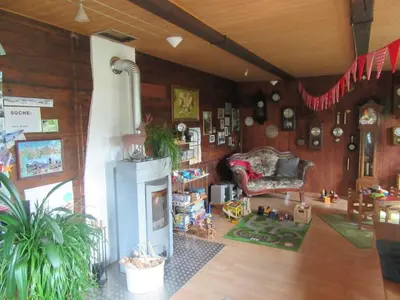 a living room with a couch and a fireplace at Holiday Home Haus Chrumis by Interhome in Sankt Peterzell