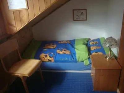 a bedroom with a bed with a disney blanket at Holiday Home Alten-Hof by Interhome in Bischofszell