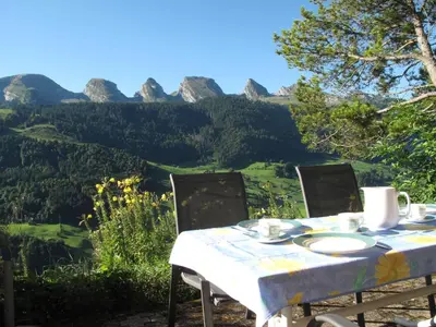 a table and chairs with a view of mountains at Apartment Gubel by Interhome in Alt Sankt Johann