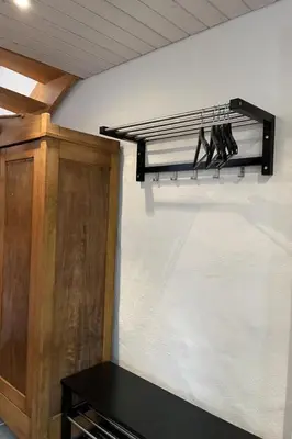 a group of shoes hanging on a wall at Apartment Sweet Home by Interhome in Wildhaus