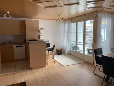 a kitchen with a table and chairs in a room at Apartment Friedegg by Interhome in Wildhaus