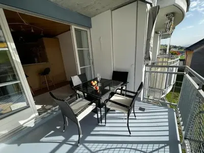 a patio with a table and chairs on a balcony at Apartment Friedegg by Interhome in Wildhaus