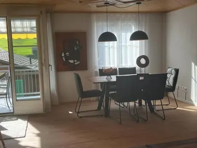 a dining room with a table and chairs at Apartment Friedegg by Interhome in Wildhaus