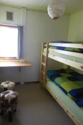 a bedroom with a bunk bed and a window at Holiday Home MECK-HEI by Interhome in Wildhaus