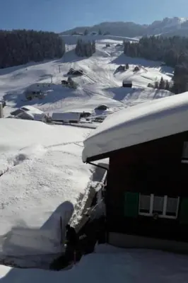 a house with snow on the roof of it at Apartment Studio Friedegg by Interhome in Wildhaus