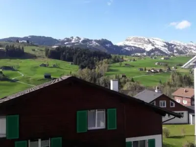 a house with a view of a golf course at Apartment Studio Friedegg by Interhome in Wildhaus
