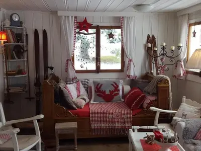 a living room with a couch and a table at Holiday Home Chalet Chic-Hot Pot by Interhome in Wildhaus