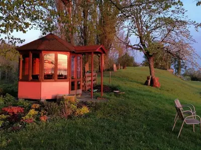 a small house in the middle of a field at Apartment Studio Ferienwohnung - 38 m2- mit Gartennutzung by Interhome in Bottighofen