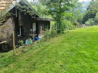 a house on a hill next to a yard at Holiday Home Bienenhaus Speicher by Interhome in Speicher