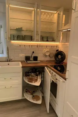 a kitchen with white cabinets and a counter with shelves at Apartment Allegra Appenzell by Interhome in Trogen