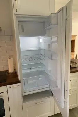 a white refrigerator with its door open in a kitchen at Apartment Allegra Appenzell by Interhome in Trogen