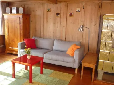 a living room with a couch and a table at Holiday Home Appenzell House by Interhome in Thal
