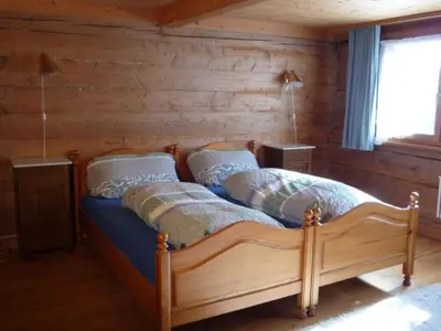a bedroom with a bed in a log cabin at Holiday Home Appenzell House by Interhome in Thal