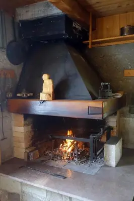 a large oven with a fire inside of it at Holiday Home das schiefe Haus by Interhome in Oberschan