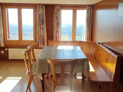 a dining room with a table and two chairs at Apartment Löhli Hof by Interhome in Lienz