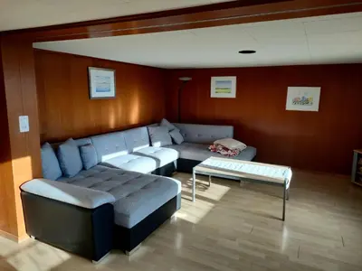 a living room with a couch and a table at Apartment Löhli Hof by Interhome in Lienz