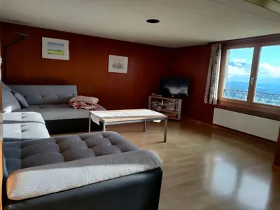 a living room with a couch and a table at Apartment Löhli Hof by Interhome in Lienz