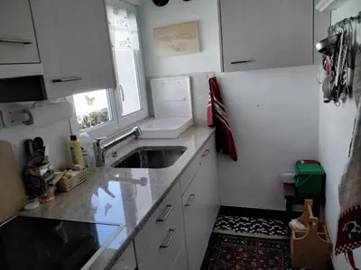 a small kitchen with a sink and a window at Holiday Home Feriehüsli by Interhome in Krummenau