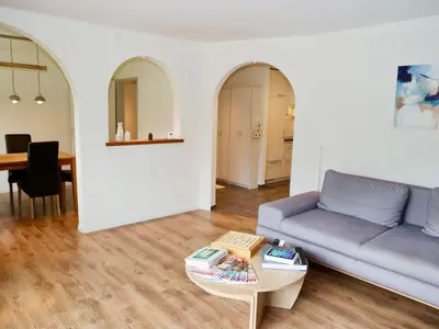 a living room with a couch and a table at Apartment Panoramablick by Interhome in Nesslau