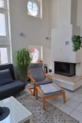 a living room with a couch and a fireplace at Apartment Zwingli's Ferienwohnung by Interhome in Nesslau