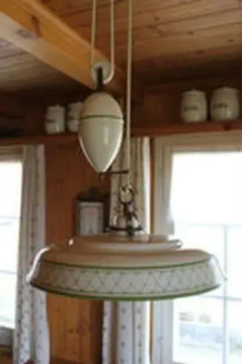 a kitchen sink with a light hanging from a ceiling at Holiday Home Obere Laui by Interhome in Nesslau