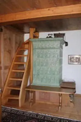 a wooden staircase in a room with a wooden at Holiday Home Obere Laui by Interhome in Nesslau