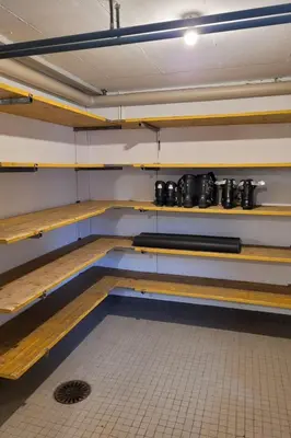 a room with wooden shelves with pots and pans at Apartment Modern kompakt Speer by Interhome in Alt Sankt Johann