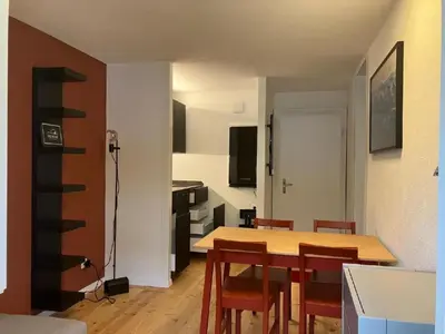 a kitchen and dining room with a table and chairs at Apartment Modern kompakt Speer by Interhome in Alt Sankt Johann