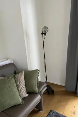 a lamp in a living room with a couch at Apartment Terrasse & Pistenähe by Interhome in Alt Sankt Johann