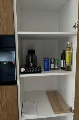 a kitchen pantry with a coffee maker on a shelf at Apartment Terrasse & Pistenähe by Interhome in Alt Sankt Johann
