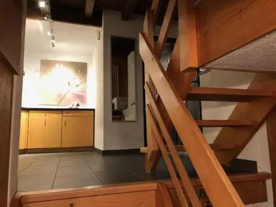 a view of a kitchen with a staircase in a house at Holiday Home Höckli by Interhome in Wildhaus