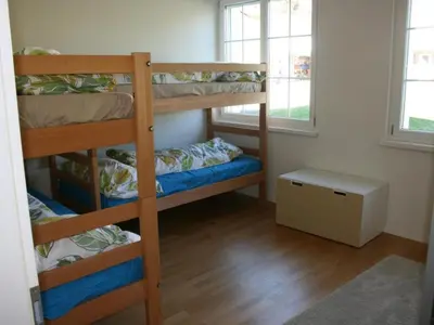 a room with two bunk beds and a window at Apartment Bädli by Interhome in Wildhaus