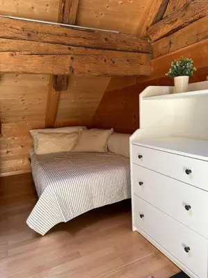 a small bedroom with a bed and a dresser at Charming Retreat for Nature Lovers near Saxerlücke in Sennwald
