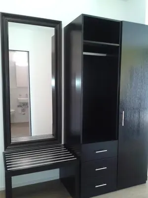 a black cabinet with a mirror in a bathroom at Hotel Swiss Bellevue in Kreuzlingen
