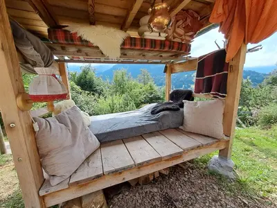 a living room with a couch and a fireplace at toDelete in Nesslau
