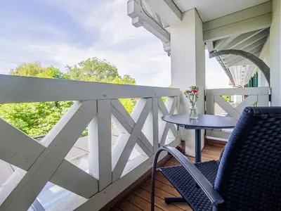 a patio with a table and chairs on a balcony at Landgasthof Seelust in Egnach