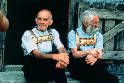 two older men sitting next to each other at Hotel Landhaus Säntis Herisau in Herisau
