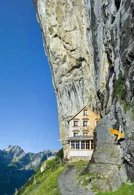 a house built into the side of a mountain at Hotel Landhaus Säntis Herisau in Herisau