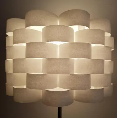 a lamp with many different shades of white at Hotel Elite Self-Check-in in St. Gallen