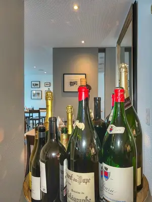 a group of bottles of wine sitting on a table at Hotel Hecht in Rheineck