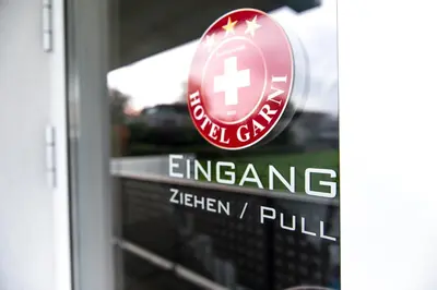 a sign on a glass door of a pharmacy at Sky Design Motel in Kriessern