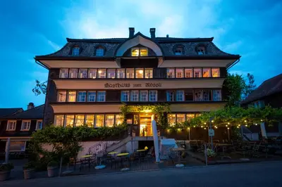 a building with a sign on the front of it at Gasthaus Rössli in Mogelsberg